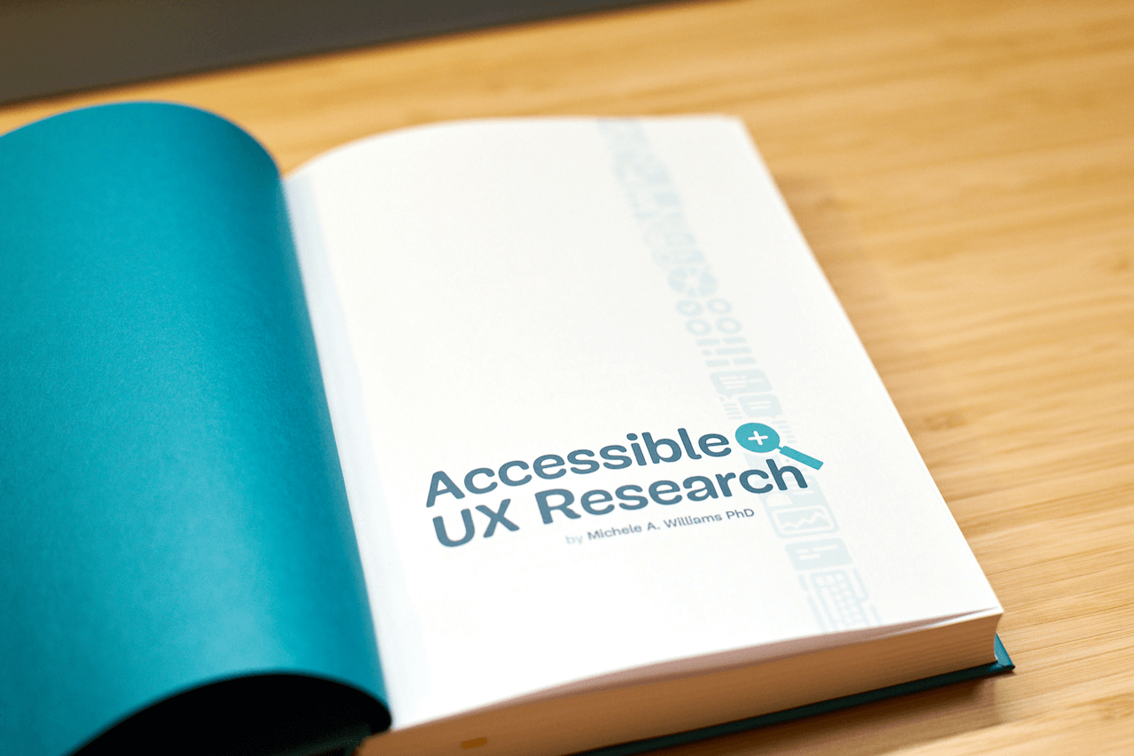A look inside the book. The left page has a teal color. The right page says &lsquo;Accessible UX Research by Michele A. Williams, PhD&rsquo; in the same teal color.